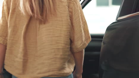 car interior with woman entering