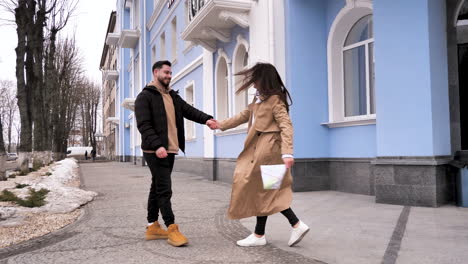 caucasian tourist couple walking through the city.