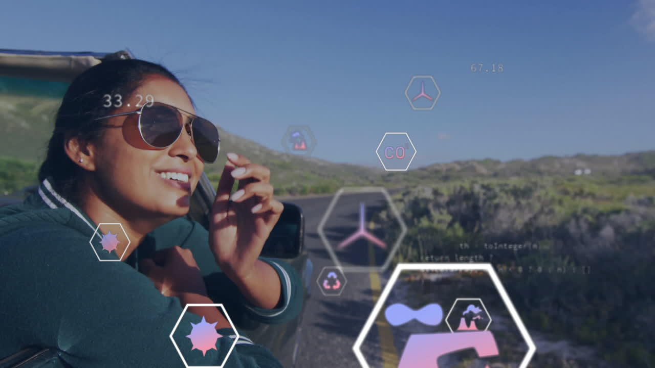 woman leaning out of car window, using hexagonal environmental tech icons overlay on rural road