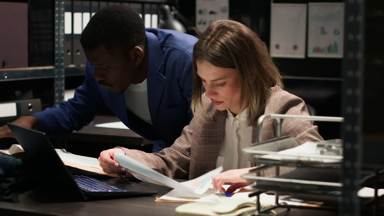 Detectives Investigating Crime Scene in Office