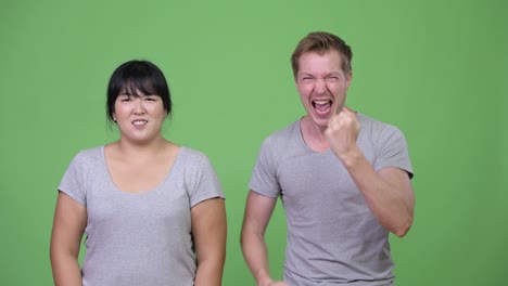 young multi-ethnic couple having different moods together