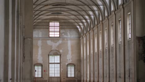 empty white interiors without people in an old hospital building in parma, italy