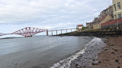 waves meet shore near iconic edinburgh bridge