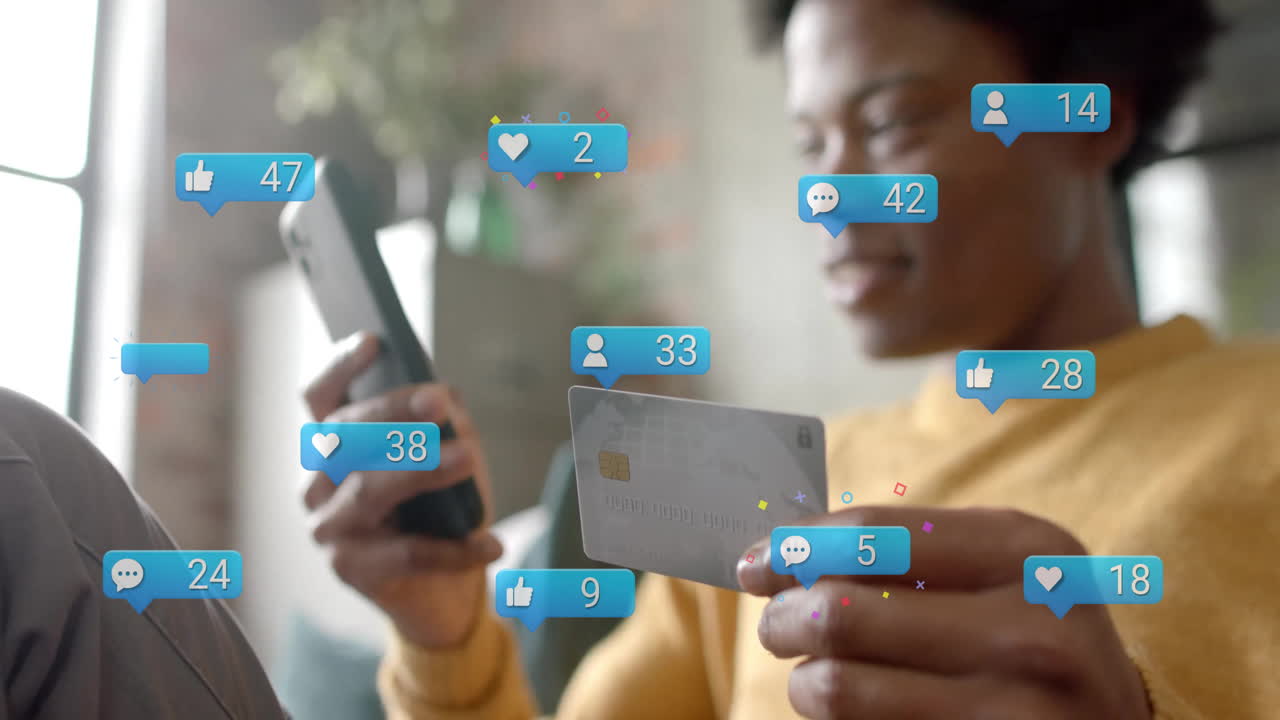 Animation of data processing over african american man paying with card over smartphone