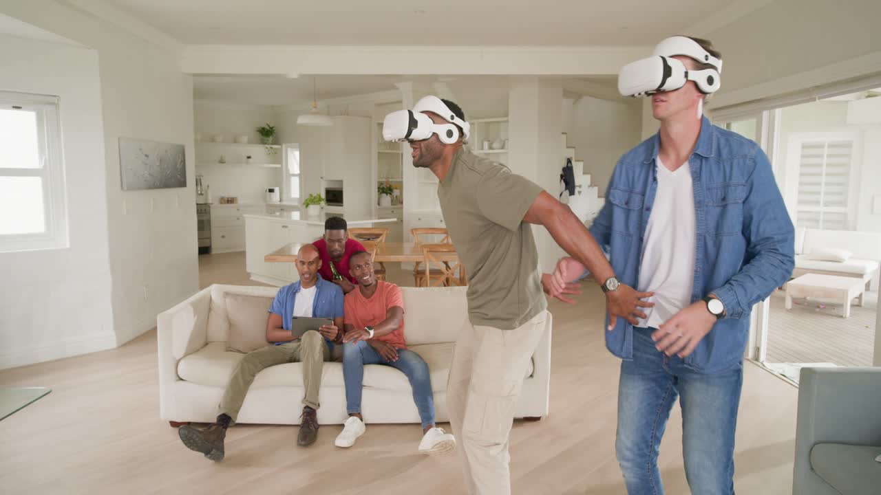 Diverse male friends starting when white VR headsets start, moving for fun in modern living room