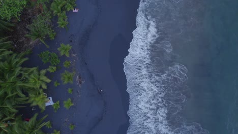 an-aerial-footage-of-black-sand-beach-in