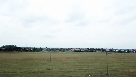 rural village landscape under cloudy sky