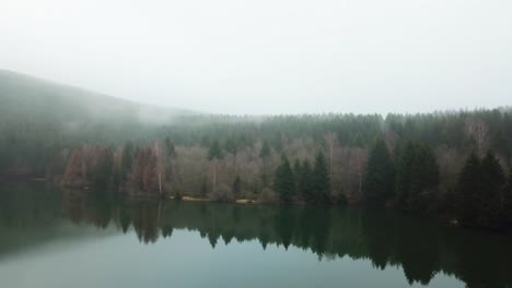 aerial view of a lake on a foggy day