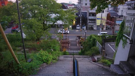 peaceful japanese town of onomichi, tilt reveal from staircase to neighborhood