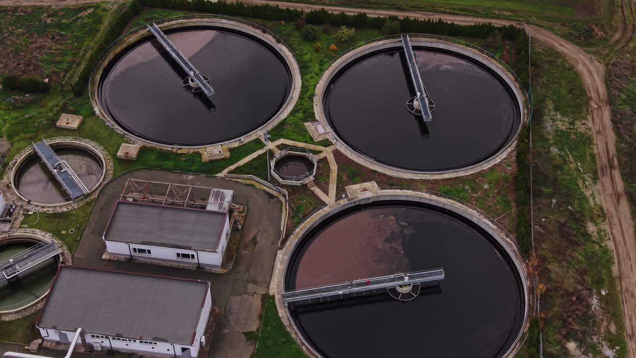 Industrial water treatment plant with large tanks and pipes