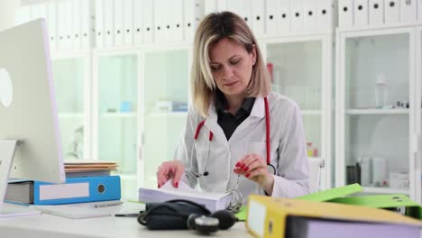 female doctor reviewing documents in her office