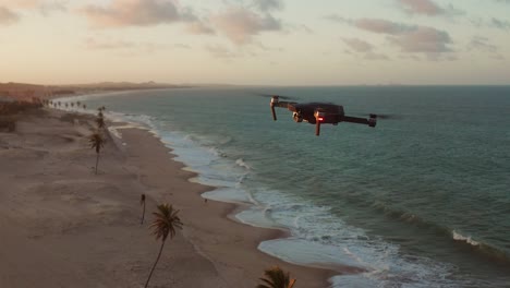 Drone-flying-during-sunset-at-Cumbuco,-Brazil