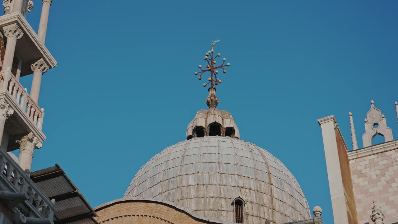 Close up on Cross Symbol top of Venice Cathedral in Italy