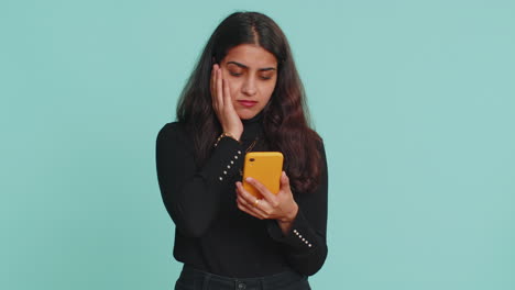 Indian-woman-use-smartphone-browsing-loses-becoming-surprised-sudden-lottery-result-bad-fortune