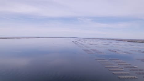 Aerial-landscape-view-of-a-shellfish-farm-near-the-ocean-in-Sete,-France