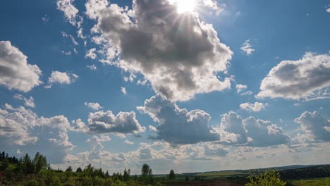 white clouds, clear soft sky, time lapse formating cloudscape in horizon, rainy rolling fast moving, beautiful summer sunny day, colourful weather.