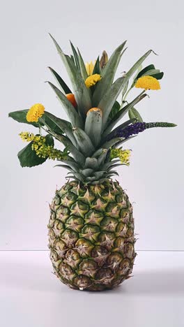 pineapple with flowers arrangement