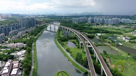 Hong-Kong-MTR-Railroad-in-the-city-outskirts,-Aerial-view