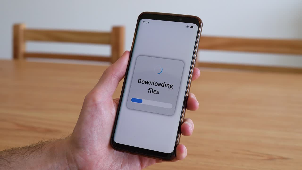 Downloading files with your smartphone. Concept of piracy through mobile apps