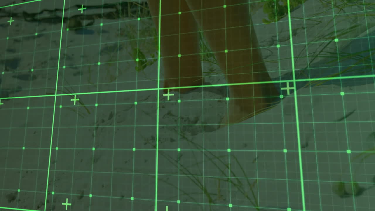 lower legs and bare feet walking across sandy dune ground under HUD green grid overlay mapping