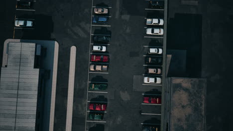 aerial view of a parking lot with parked cars