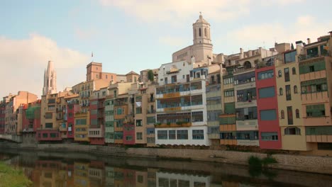 onyar river with view of colorful ancient houses and cathedral in girona, catalonia, spain