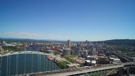 aerial pulling away from the record holding fremont bridge in portland, oregon