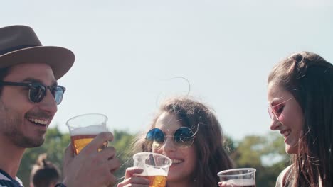 Men-chilling-with-drinks-at-the-music-festival