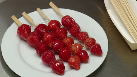 candied strawberries on skewers