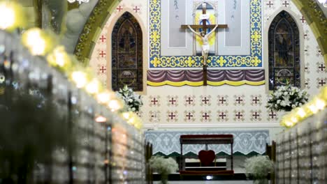 Truck-caption-through-the-aisle-of-a-church-altar-with-jesus-cross-behind-it