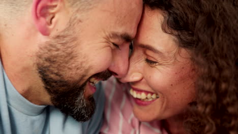 happy young couple rubbing their nose together