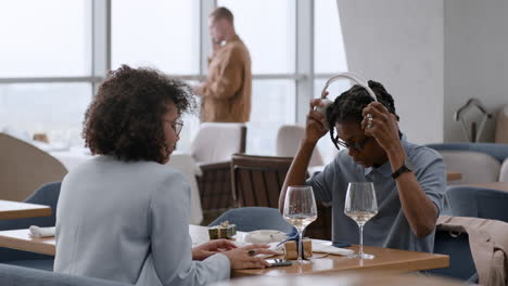 couple enjoying a meal and music in a modern restaurant