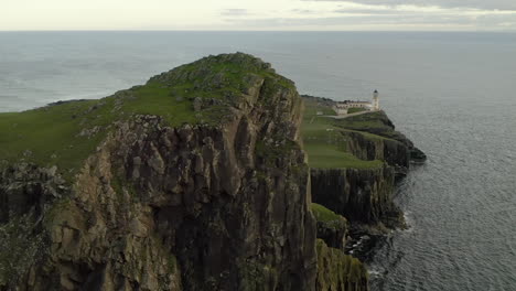 An-aerial,-evening-view-of-Neist-Point-Lighthouse-on-the-Isle-of-Skye