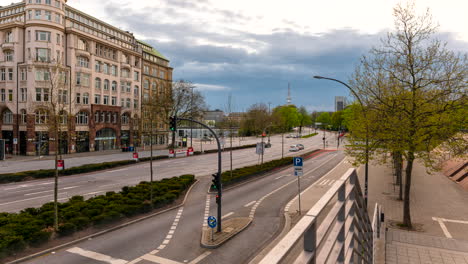 Moving-time-lapse-of-beautiful-historic-building-of-Kunsthalle-with-huge-intersection,-traffic-and-Heinrich-Hertz-Tower-in-Hamburg,-Germany