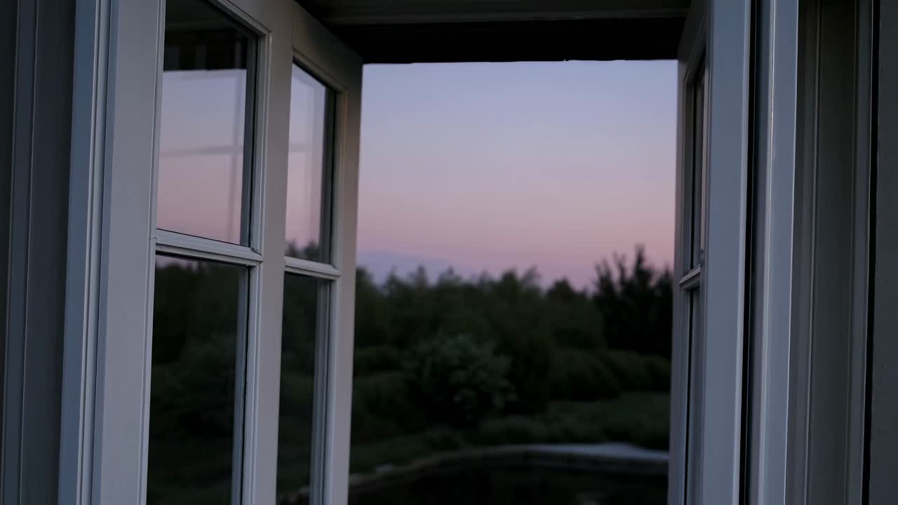 A serene video scene from a low-angle view through open French doors, capturing a tranquil twilight