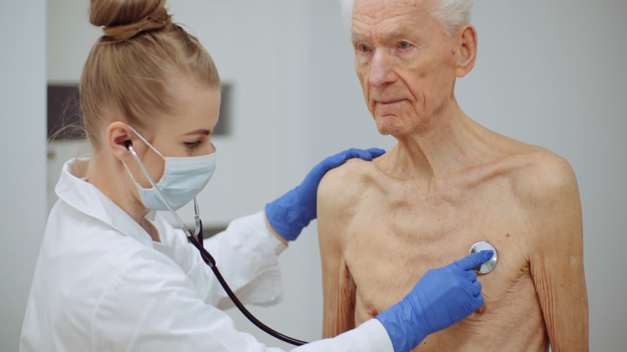 Female Doctor Examine Elderly Man With Stethoscope 5