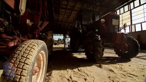 vintage tractors in a warehouse
