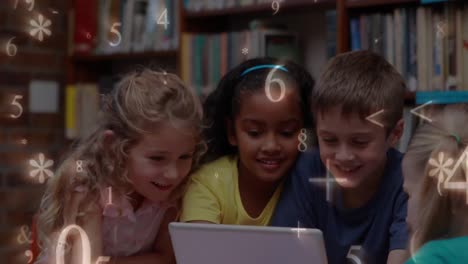 kids studying on a tablet in the library