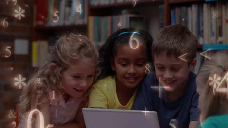 niños estudiando en una tableta en la biblioteca