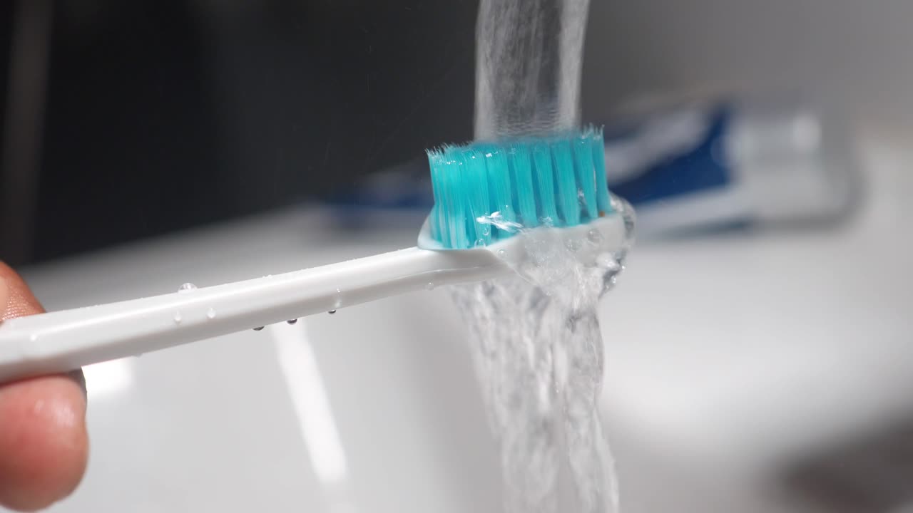 Toothbrush under running water