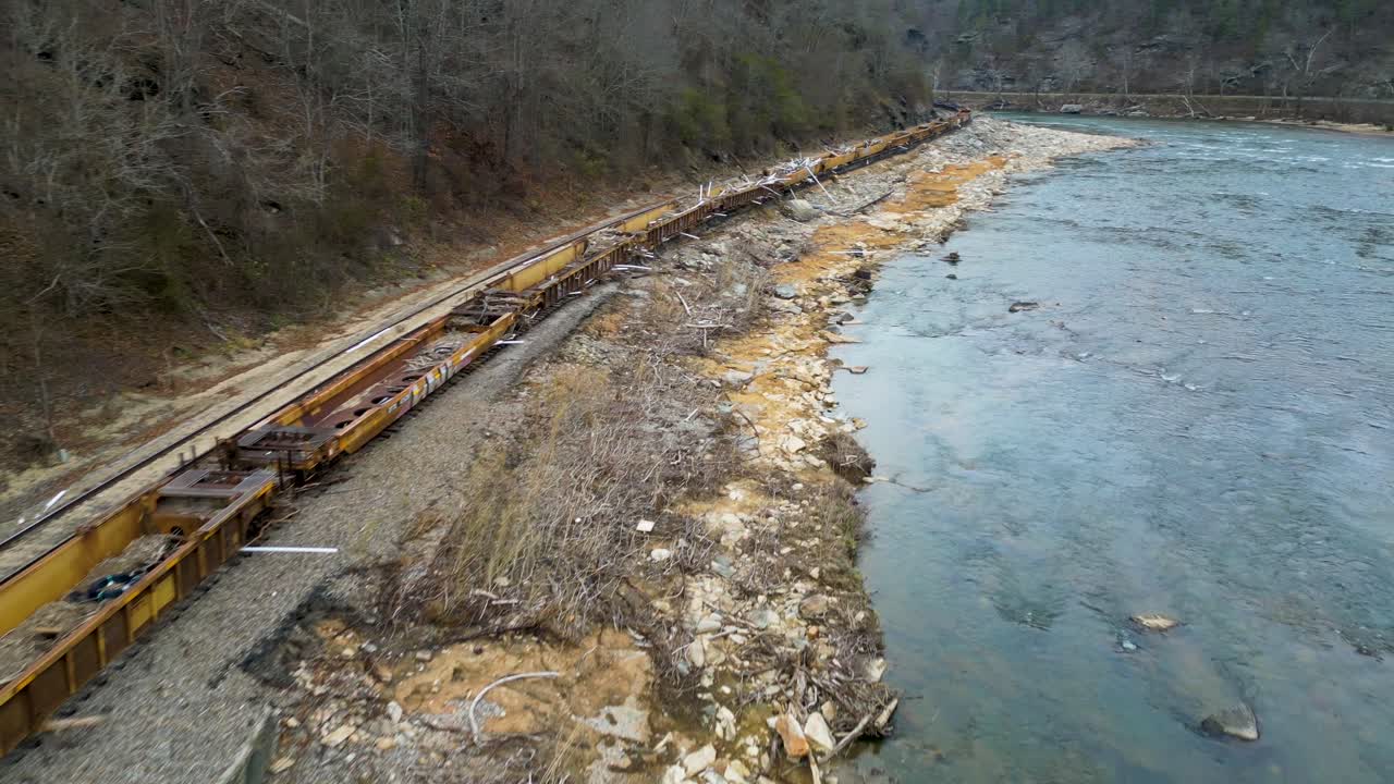 4K Aerial Drone Video of Train Loaded with PVC Pipes and Debris from Hurricane Helene Stranded on Track Along French Broad River near Marshall, NC (2024)