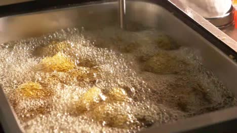 Bubbling-Hot-Oil-In-Deep-Fryer-In-Kitchen