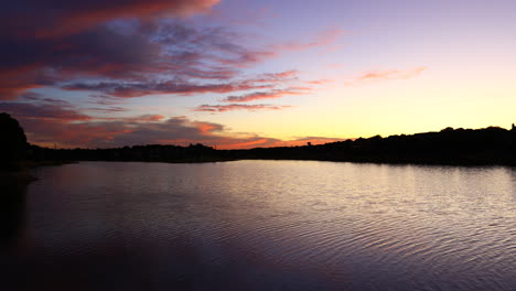 this is a video of a colorful sunset over lake lewisville in highland village texas