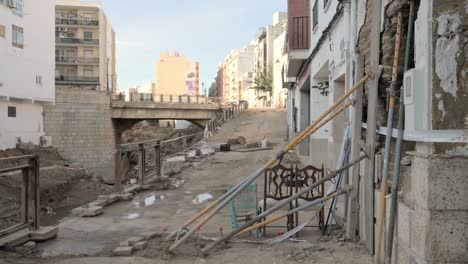 Construction Work in a City Street with a Bridge