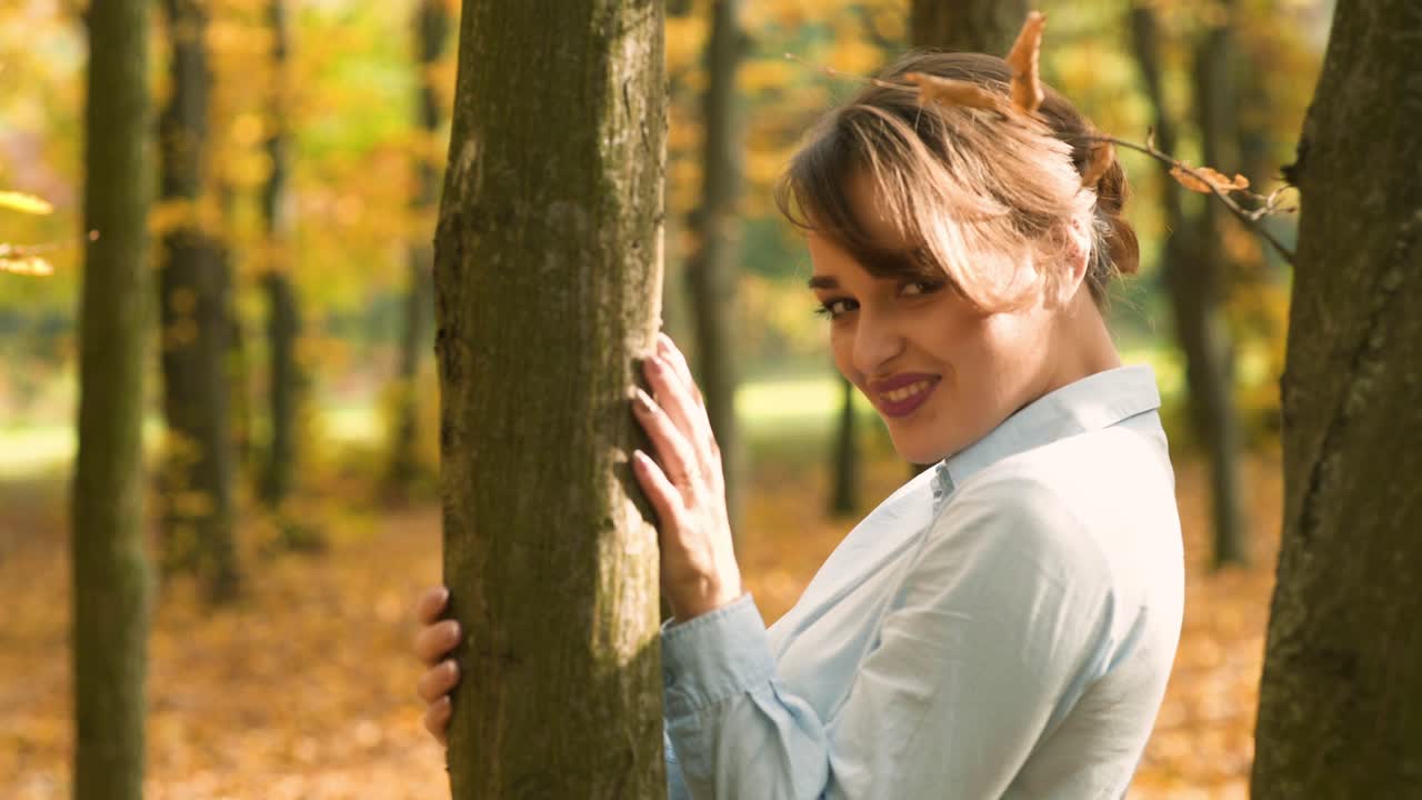 Autumn woman in autumn park. Autumn woman in autumn park. Warm sunny weather. Fall concept