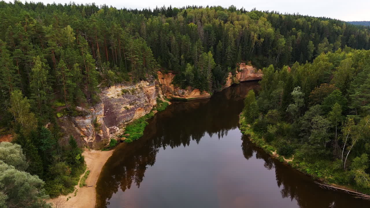 Spectacular Birds Eye Reveal Over The Ancient Sandstone Cliffs (Erglu Klintis) And Devonian Rock Formations Along The Famous Gauja River Valley In Gauja National Park, Latvia.