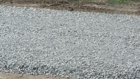 excavator carries gravel in the bucket