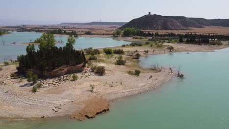 Sotonera-Dam-Lake-in-Huesca,-Spain---Aerial-Drone-View-of-the-Turquoise-water-and-Island