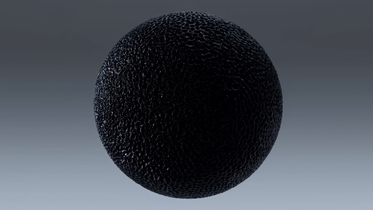 Black Textured Sphere Floating In Studio Monochrome Macro Shot Showing Matte Foam Surface, Granular Detail,