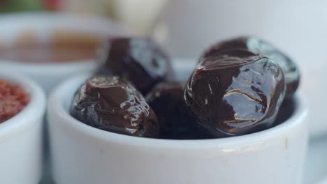 black olives in a white bowl